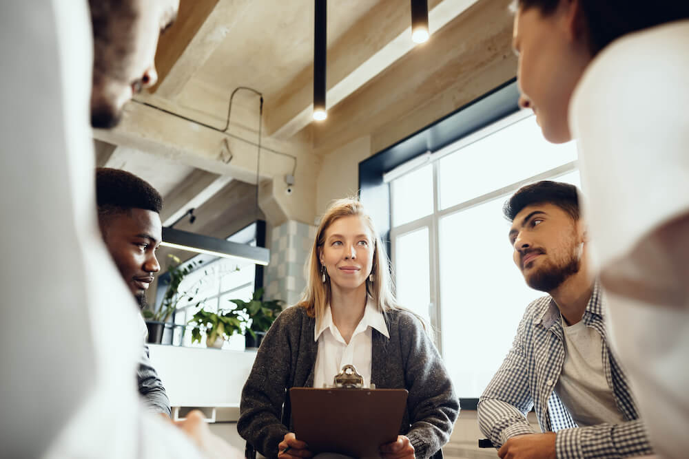 Woman leading a meeting to launch a donor prospecting campaign