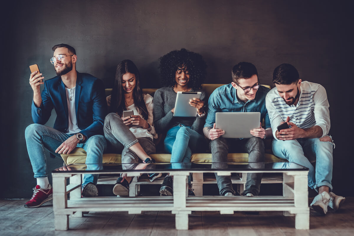 Social media team using different gadgets