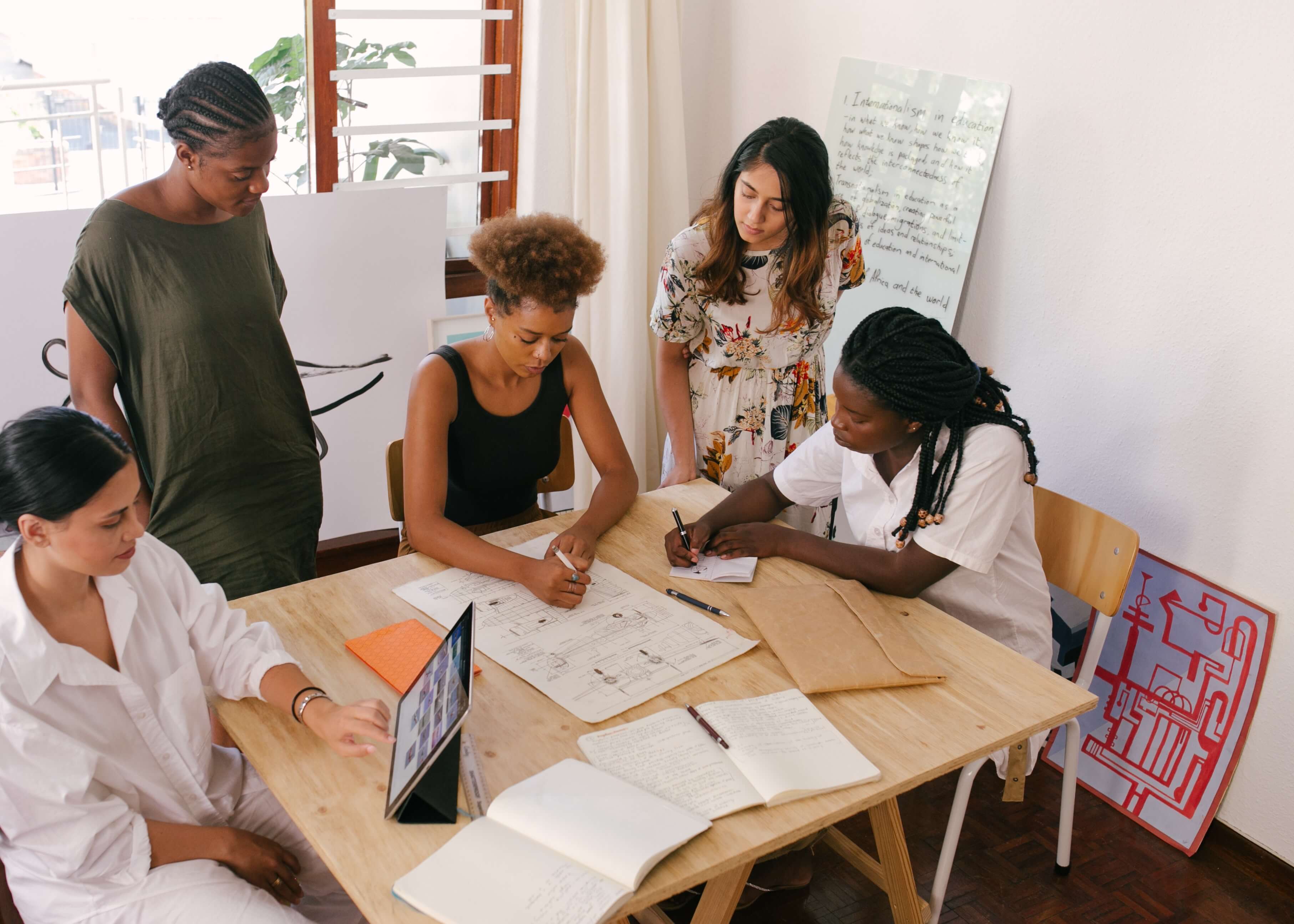 Nonprofit staff drafting impact report