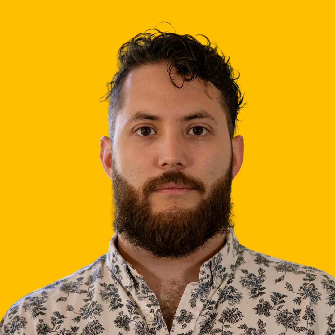 mauricio's headshot against a yellow background
