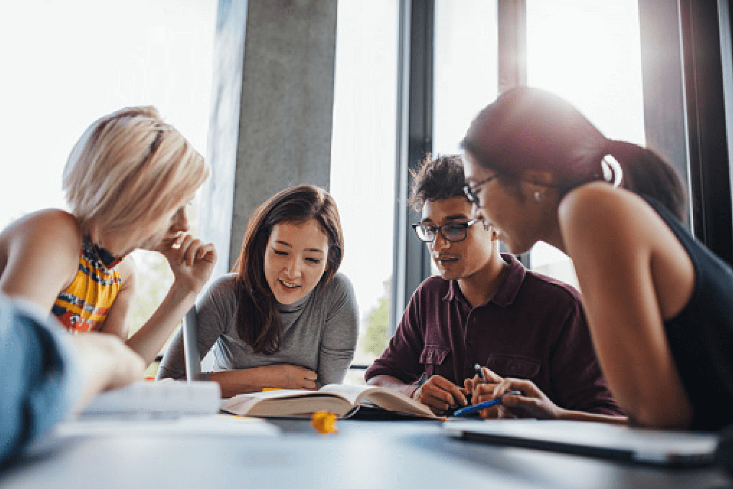 Group Of Young People Reading