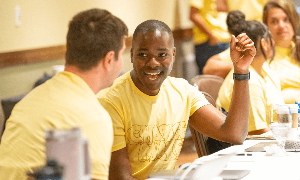 Floyd from Givebutter fam chatting with coworker