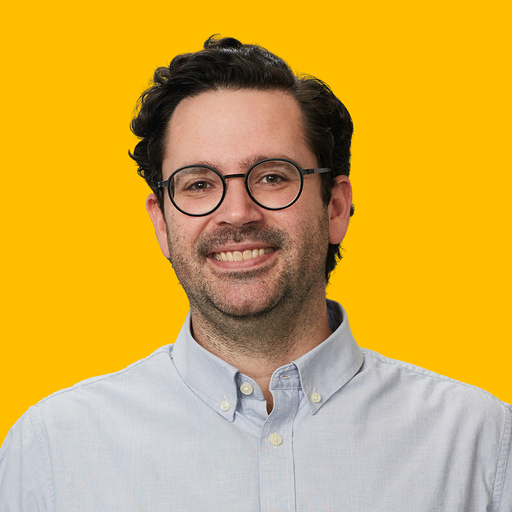 Ty's headshot against yellow background