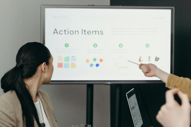 People in a meeting discussing action items