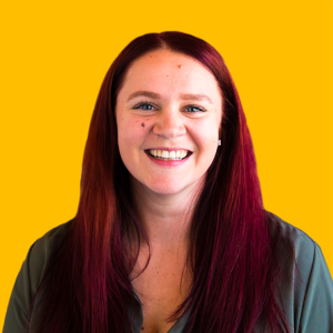 Stephanie's headshot against a yellow background