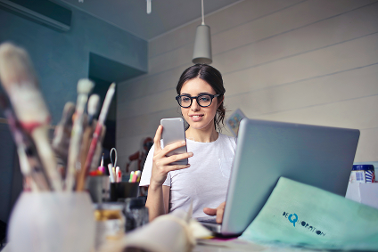A young person exploring nonprofit apps on their phone