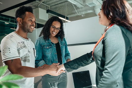 team shaking hands on successful nonprofit event management