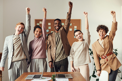 Team celebrating successful nonprofit fundraising