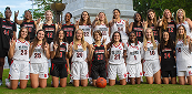 Women's basketball team posing in NC State uniforms