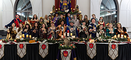 FHS choir in Renaissance attire at a decorated banquet