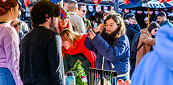 Shoppers at a busy pop-up marketplace